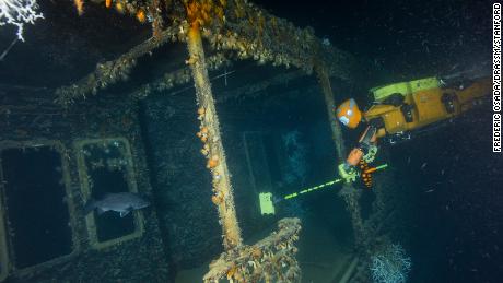 The robot drives a boom camera into the hull of the Italian steamer Le Francesco Crispi.