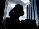 A pedestrian strolls through the Yonge and Dundas neighborhoods in Toronto on July 19.  SARS-CoV-2 can mutate into a mild version, but a catastrophic strain can't be ruled out, says an expert.