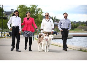 Leela Aheer, second from left, walks with her sons and husband Malkeet Aheer, second from right, on the promenade in Chestermere, east of Calgary, Wednesday, June 8, 2022.  She has joined the race for Alberta's UCP leadership.