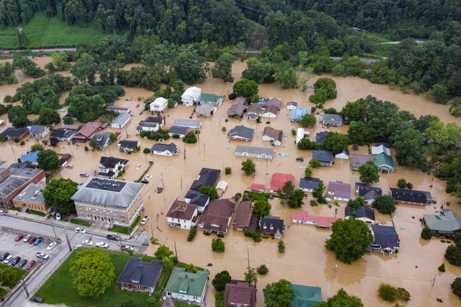 A new study published this week concludes that weather disasters, made worse by the warming climate, are making a variety of pathogens worse that make people sick.  Here on July 28 in Jackson, Kentucky, an area of ​​homes is inundated by flooding along the North Fork of the Kentucky River.