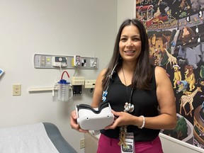 Alexandra Zorzi, associate scientist at Lawson Health Research Institute and pediatric oncologist at Children's Hospital, is part of a team studying whether virtual reality can help reduce anxiety in pediatric cancer patients during routine treatment.  If successful, virtual reality headsets could be used to help children remain calm during other medical procedures, according to the researchers.  (Jennifer Bieman/The London Free Press)