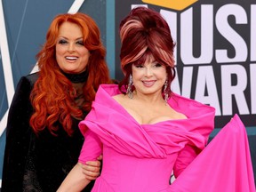 Wynonna Judd, left, and Naomi Judd, right, attend the 2022 CMT Music Awards on April 11, 2022 at the Nashville Municipal Auditorium.