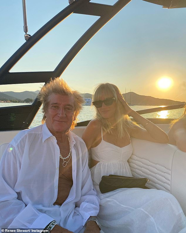 Quality time: Rod Stewart looked in full holiday mode as he posed with his daughters in family snaps from the Portofino trip (pictured with Kimberly, 42, as they relaxed on a boat together