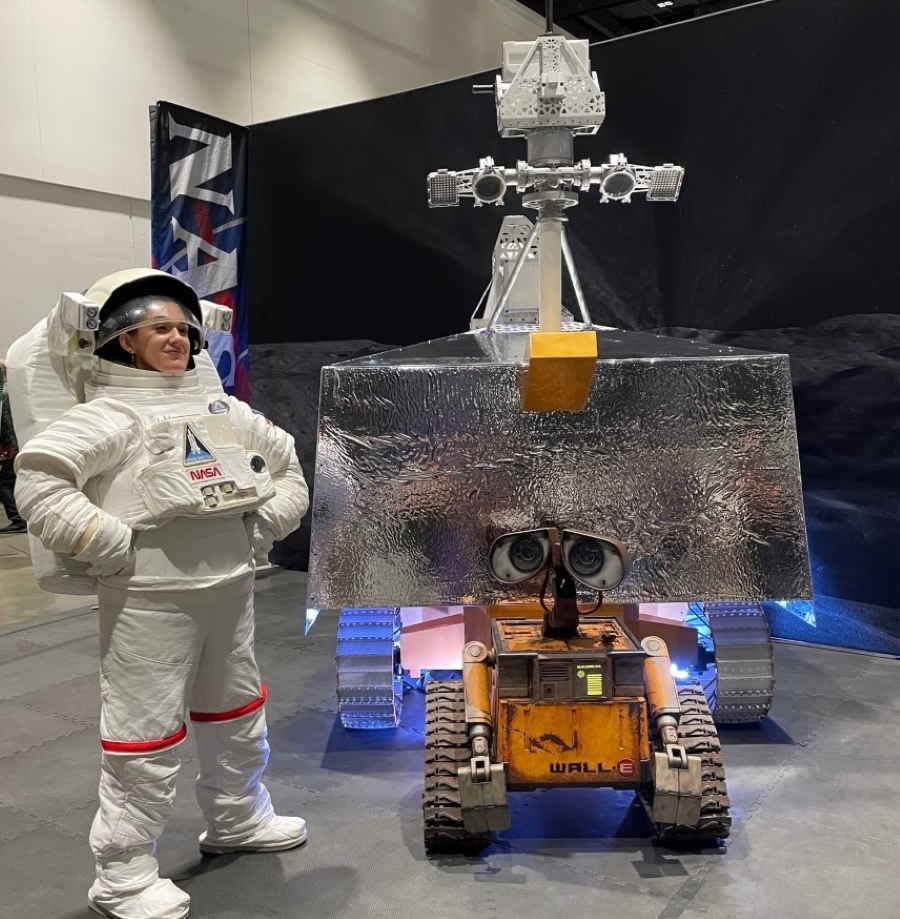 NASA's VIPER rover model with a remote-controlled WALL-E robot and a woman in an astronaut suit