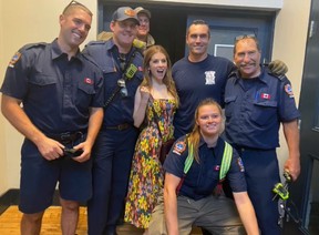 Actress Anna Kendrick poses with Toronto Firefighters (left to right) Brian White, Mike Dinsmore, Shane Elliot, Scott Fitzpatrick, Scott Tyrrell and Megan Campbell who work at Toronto Fire Service Stations 332 and 331 respectively.