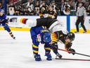 Germany's Maksymilian Szuber (4) outpaces Sweden's Jonathan Lekkerimaki (24) during the third phase of the IIHF World Junior Hockey Championship on Monday August 15, 2022 in Edmonton.