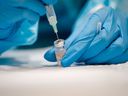 A nurse prepares the Pfizer-BioNTech Covid-19 vaccine on November 24, 2021 in Montreal, Quebec.