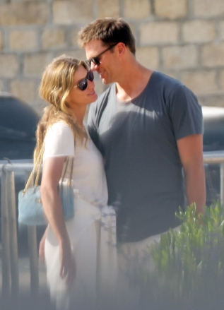 SAINT-TROPEZ, FRANCE - *EXCLUSIVE* - Tom Brady cuddles up to his wife Gisele Bunchchen as the couple enjoy a romantic getaway in Saint Tropez.  The Brazilian model smiled as Tom leaned in and whispered something in her ear when the pair were briefly spotted on a casual outing over the weekend.  The couple, who have been married for 13 years, have spent some time together before Tom returns to the field for his 23rd NFL season after originally announcing his retirement in February.  The seven-time Super Bowl champion and five-time Super Bowl MVP announced about a month later that he had changed his mind and would be playing another season with the Buccaneers.  *PHOTOS TAKEN 27/06/2022* Image: Gisele Bundchen, Tom Brady backgrid.com *UK Clients - please pixelate faces before publishing*