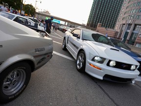 Ford Mustangs from across the United States line the streets prior to the North American International Auto Show in Detroit, Michigan September 14, 2022 ahead of the launch of the latest generation Ford Mustang.