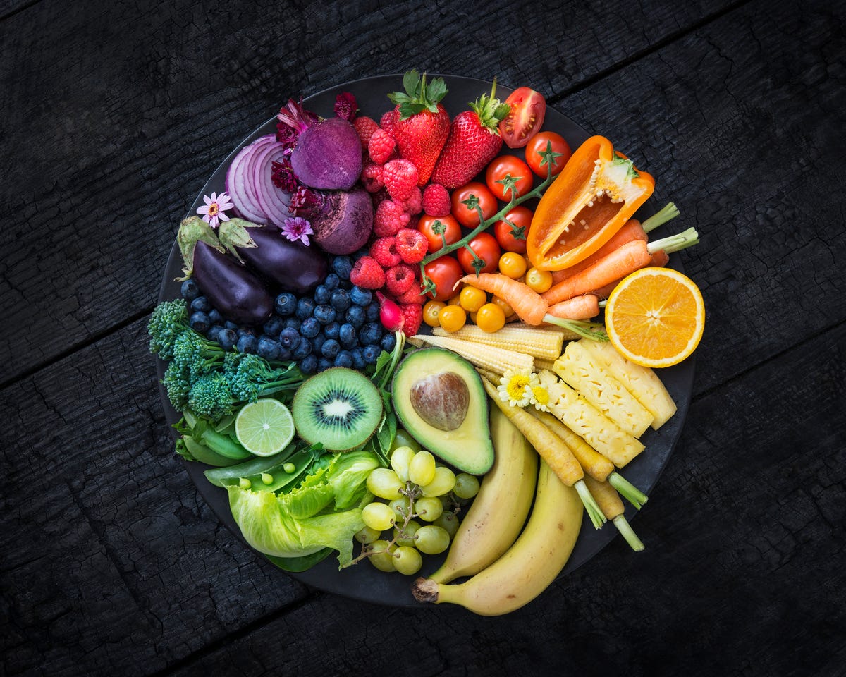 A bright rainbow spectrum of products on a platter.