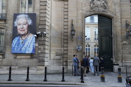 A portrait of Britain's Queen Elizabeth II hangs in front of the British Embassy in Paris, France, on September 08, 2022.  Britain's Queen Elizabeth II is under the medical supervision of her doctors on the advice of her Scottish estate, Balmoral Castle, according to a statement from Buckingham Palace on September 8, 2022, concerned for the health of the 96-year-old monarch.  Queen Elizabeth is said to be under medical supervision, Paris, France - September 08, 2022