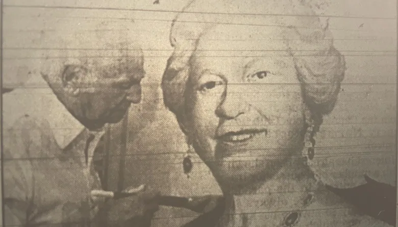 Sudbury artist Bruno Cavallo uses a brush on a large painting of Queen Elizabeth II. 