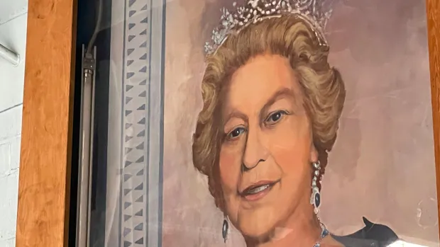 Queen Elizabeth's portrait will continue to face slapshots at northern Ontario's ice rinks for now |  CBC News