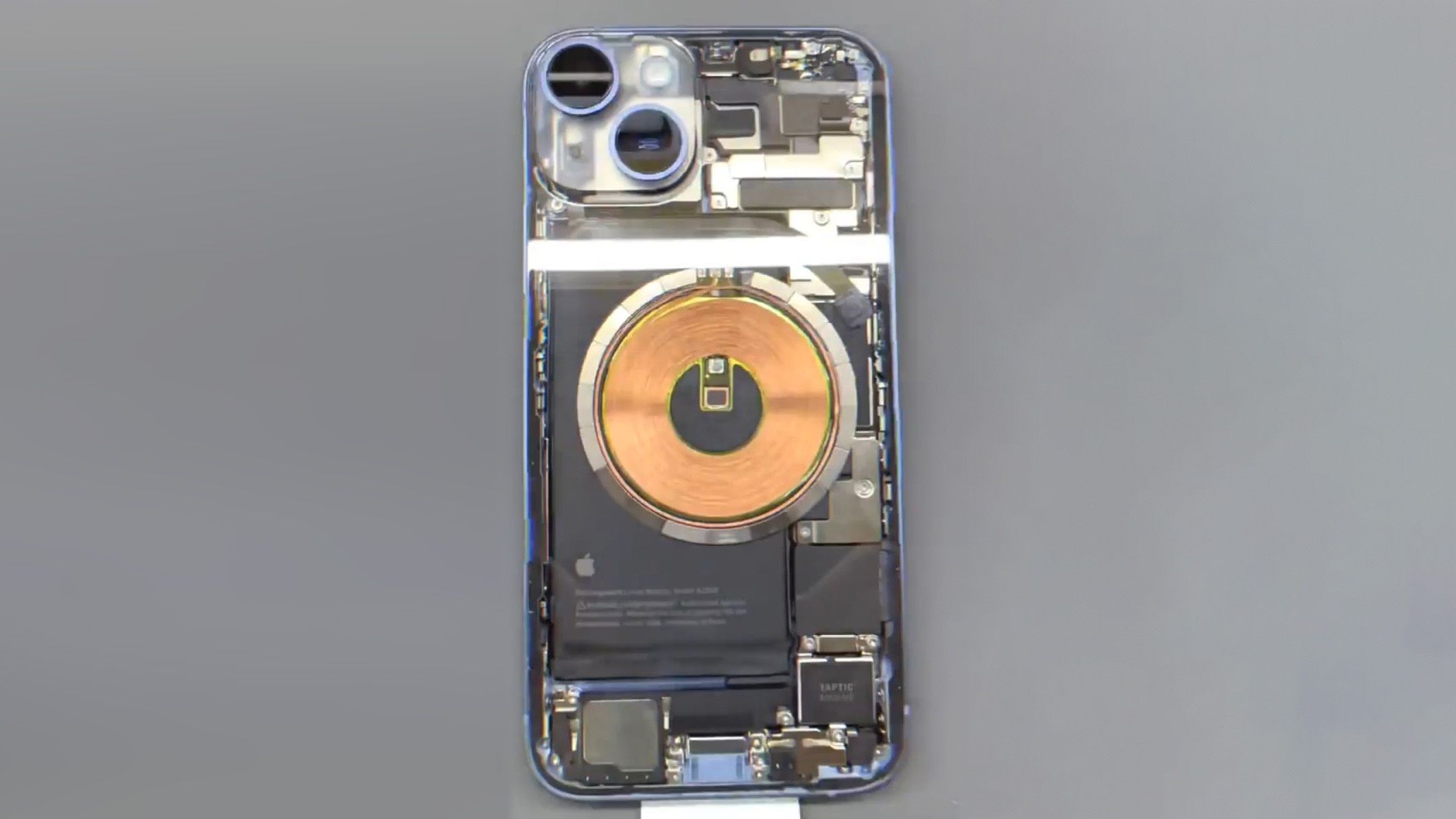 iPhone 14 Modified with transparent glass panel on the back to reveal internal parts