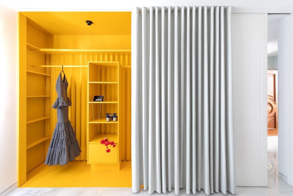 Ten houses with walk-in closets that store clothes in interesting ways