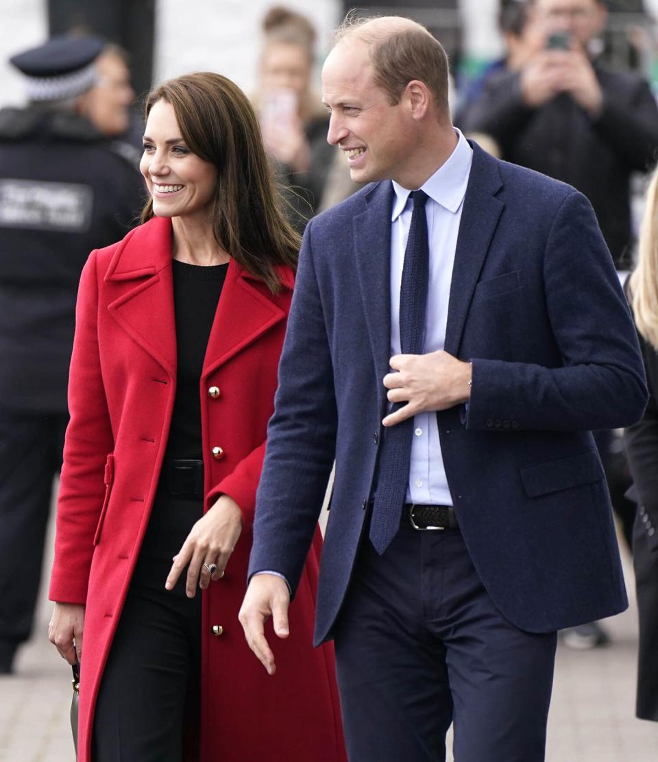 The Prince and Princess of Wales smile at the public during a visit to the Holyhead Marine Cafe and Bar in Holyhead, Wales, where they meet representatives of small businesses and organisations, including the Coast Guard and Midshipmen