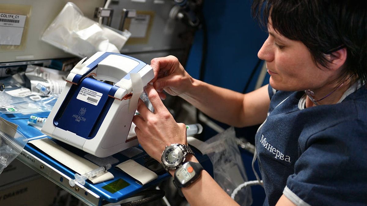 astronaut testing a medical device