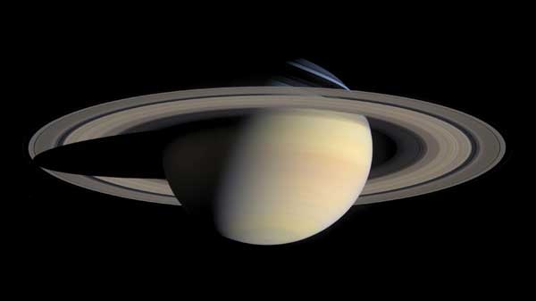 A new theory holds that Saturn once had another moon that brought it out of resonance with Neptune