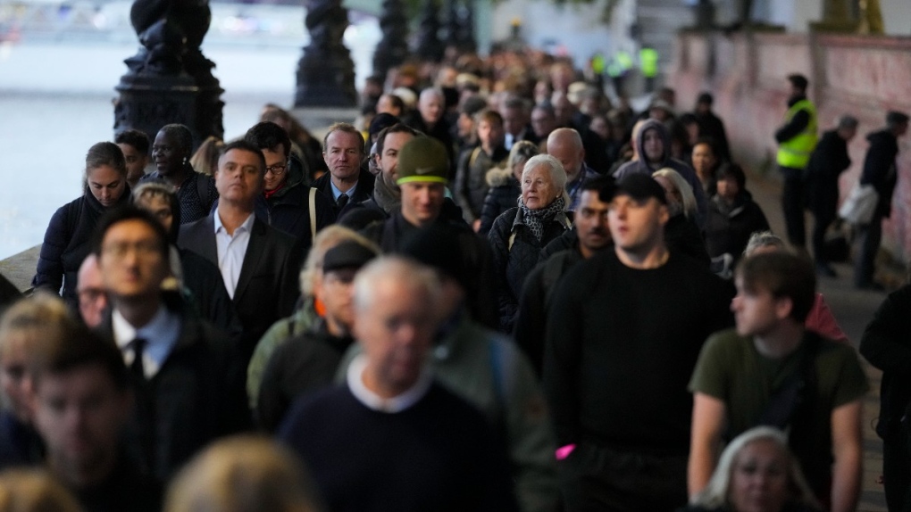 Crowds queue for the Queen's coffin while Charles enjoys a quiet day