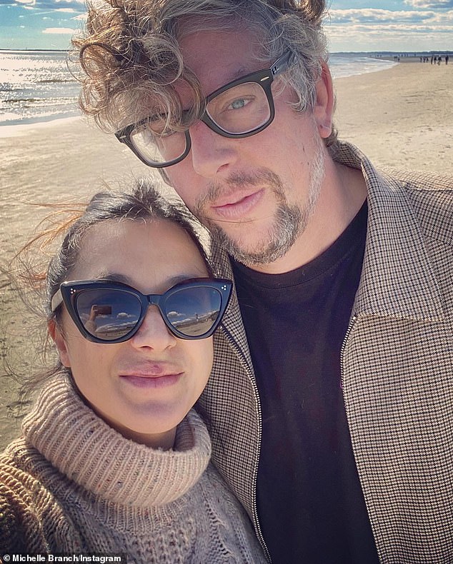 Regret: Grammy winner Michelle Branch now regrets tweeting (and then deleting) an allegation that her second husband - five-time Grammy winner Patrick Carney - cheated on her on August 10 (pictured November 26)