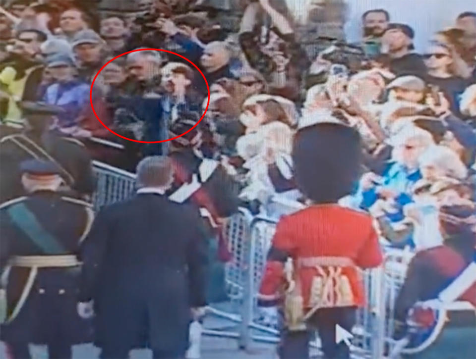 The heckler, circled in red, appeared to shout 