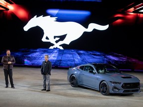 Ford Mustang chief engineer Ed Krenz (R) talks about the seventh generation 2024 Ford Mustang during its global debut at a Mustang Stampede event at the 2022 North American International Auto Show September 14, 2022 in Detroit, Michigan.  The North American International Auto Show opens to the public on September 17th.