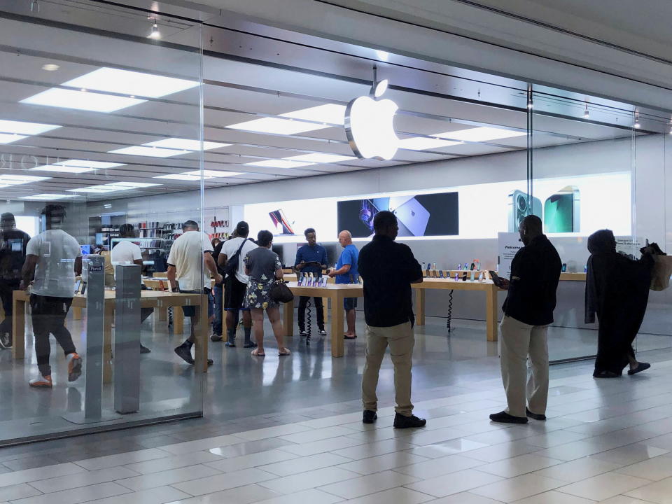 People visit the Apple Store at Cumberland Mall in Atlanta, Georgia, U.S. May 3, 2022. REUTERS/Alyssa Pointer