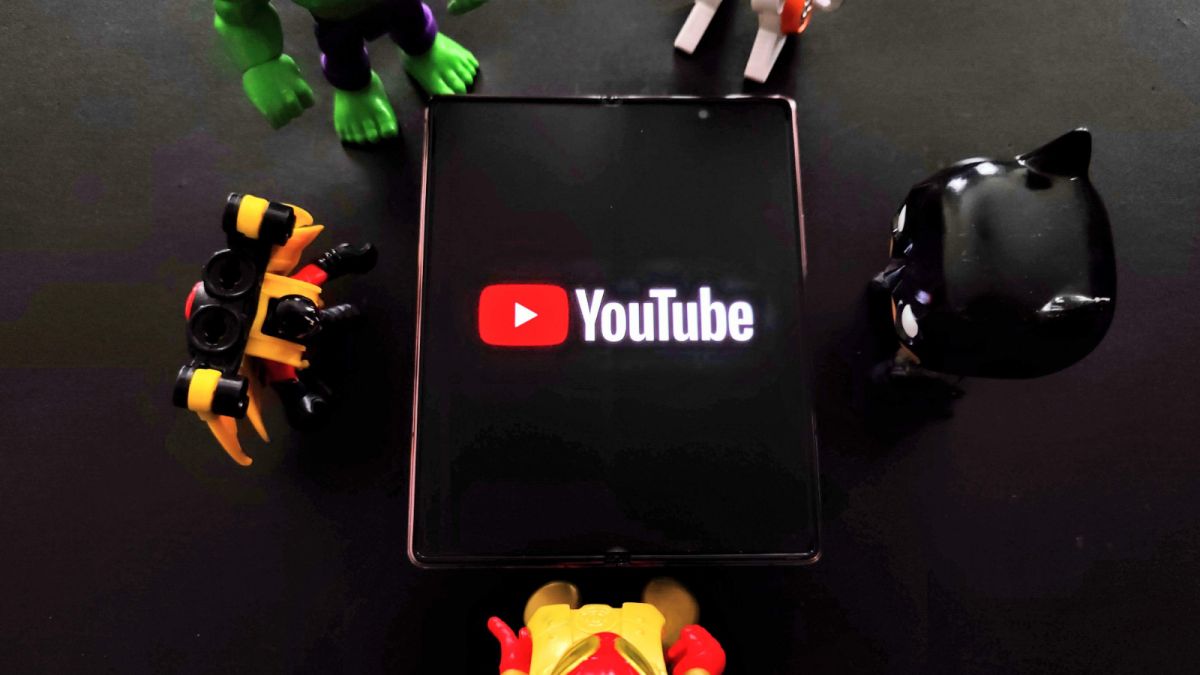 YouTube on Galaxy Z Fold 2 with toys around it