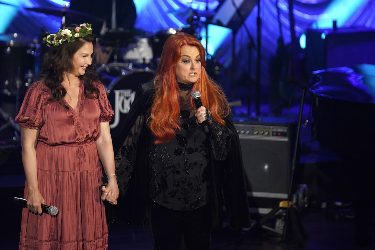 Wynonna Judd addresses rumor that she is 'fighting' with sister Ashley over mother Naomi's estate.