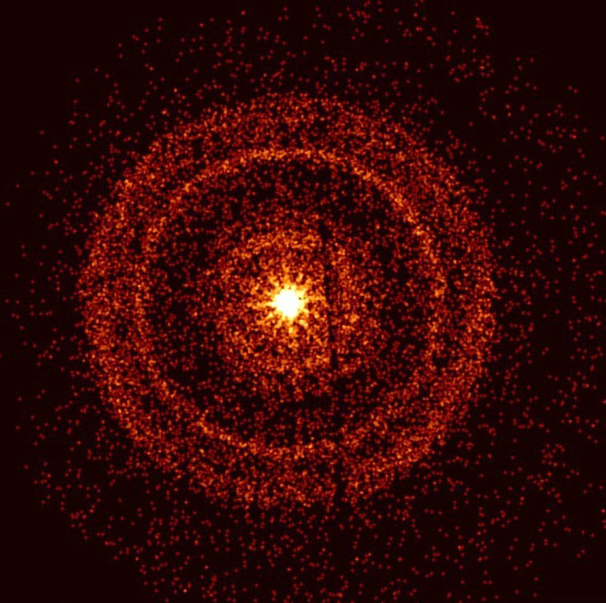 Bright orange, somewhat granular rings are visible around a bright yellow dot in the center of the image.