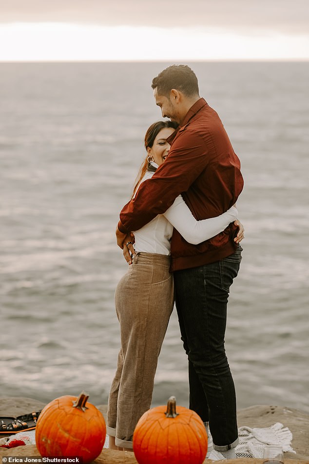 Happily ever after: The second engagement took place by the sea, with Thomas getting on one knee while a surprised Becca looked on