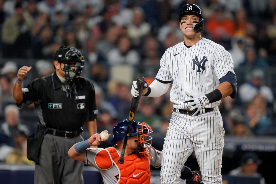 Aaron Judge of the New York Yankees reacts after scoring against the Houston Astros in the fourth inning of Game 3 of an American League Championship baseball series on Saturday, October 22, 2022 in New York.  (AP Photo/John Minchillo)