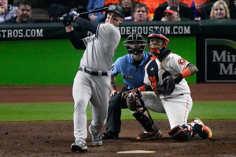 New York Yankees Anthony Rizzo (48) hits a solo homer in the eighth inning in Game 1 of the American League Championship Series between the Houston Astros and the New York Yankees Wednesday, October 19, 2022 in Houston.  (AP Photo/Sue Ogrocki)