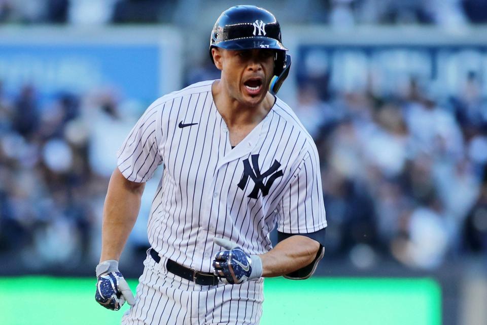 10/18/2022;  Bronx, New York, USA;  New York Yankees designated hitter Giancarlo Stanton (27) reacts as he rounds the bases after hitting a triple home run against the Cleveland Guardians in the first inning in game five of the ALDS for the 2022 MLB Playoffs at Yankee Stadium.  Mandatory Credit: Wendell Cruz-USA TODAY Sports