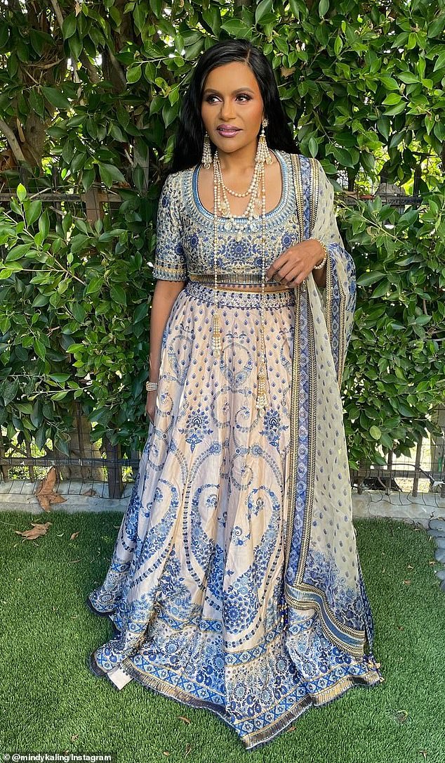 Porcelain goddess: The founder of Kaling International also modeled two stunning creations by renowned Indian fashion designer Tarun Tahiliani in a previous post on Wednesday.  Mindy's first look was a blue and white dress that resembled a traditional china-style pattern