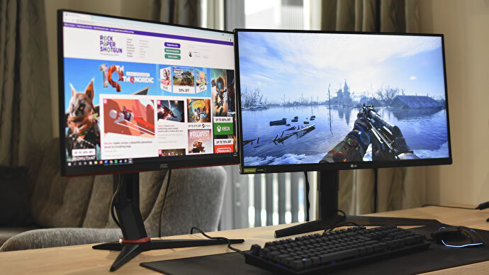 Two PC monitors on a desk, one showing Metro Exodus and one showing RPS in a browser.