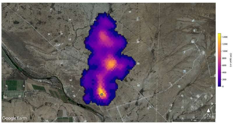 This NASA/JPL-Caltech Handout satellite image shows a two-mile (3.3-kilometer) long methane plume forming the NASA Earth's surface