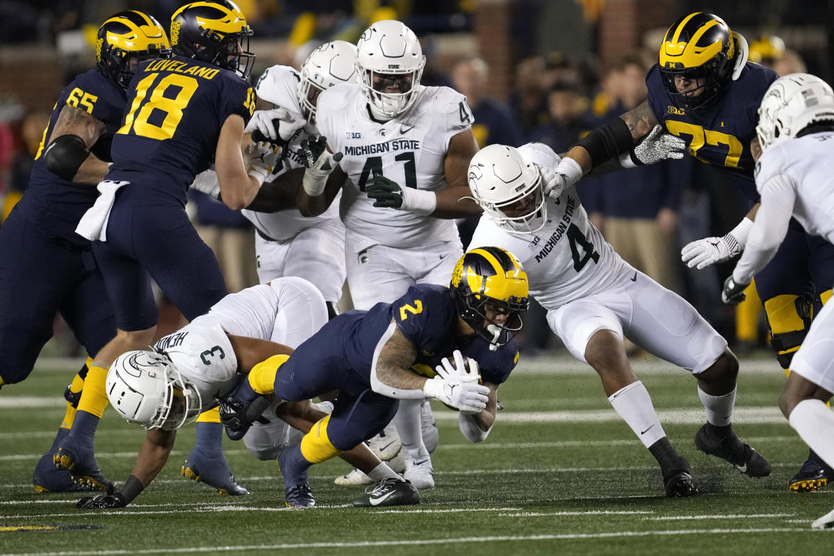 Jim Harbaugh: Michigan players were 'attacked' in an altercation with Michigan State players in a post-game tunnel.