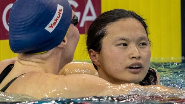 Canadian Maggie MacNeil wins record gold in the 100m butterfly at the World Cup in Toronto  CBC sport