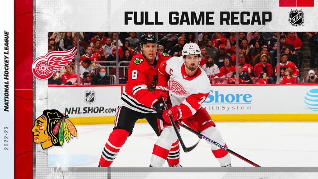 Domi, Blackhawks rally for OT win over Red Wings in home opener