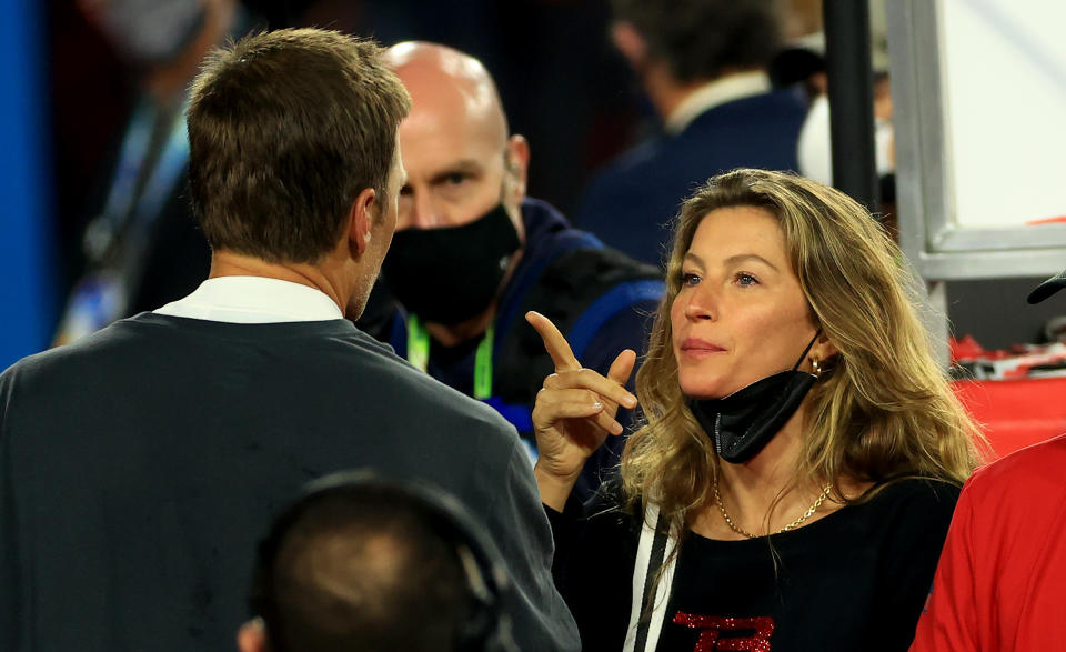 Gisele Bundchen (right) and Tom Brady have reportedly hired divorce lawyers.  (Photo by Mike Ehrmann/Getty Images)