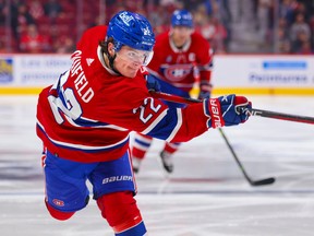 Cole Caufield of the Canadiens puts a shot through during a game against the Arizona Coyotes in Montreal on Thursday October 20, 2022.