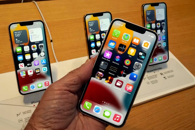 The Apple iPhone 13 lineup is shown on the first day of sales in New York, Friday, September 24, 2021, iPhone 13 mini, foreground, iPhone 13, iPhone 13 Pro and iPhone 13 ProMax, left of right, background.