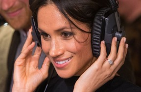 PODCASTING PLATITUDES: Britain's Prince Harry's fiancee, US actress Meghan Markle, listens to a program on headphones during a visit to community radio station Reprezent 107.3FM in Brixton, southwest London, January 9, 2018.  (DOMINIC LIPINSKI/AFP via Getty Images)