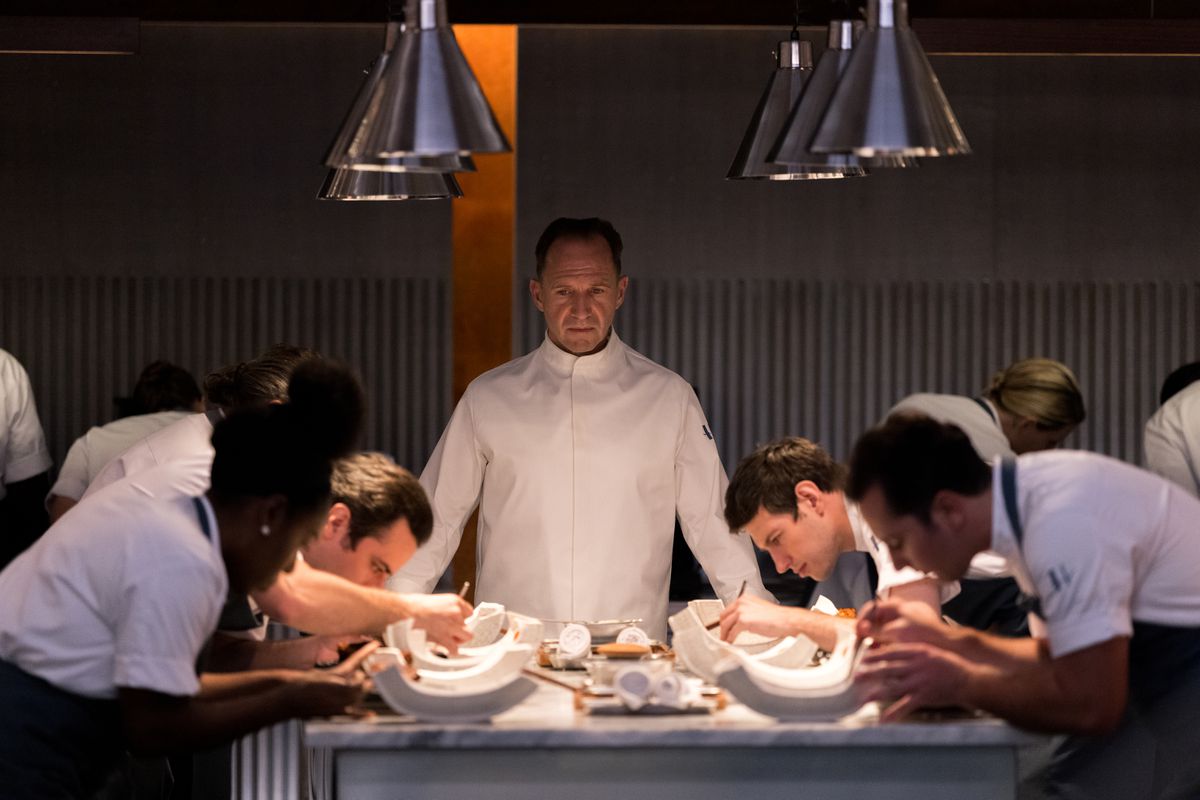 Review: Ralph Fiennes chews The Menu's scenery with relish, while satire about the rich man's food hits the nail on the head