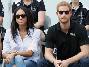 DRUNK IN SANCTIMONY: Prince Harry (R) and Meghan Markle participate in a wheelchair tennis match during the 2017 Invictus Games at Nathan Phillips Square on September 25, 2017 in Toronto.